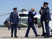 President Joe Biden returns a salute as he walks to board Air Force One to travel to Louisiana to view damage caused by Hurricane Ida, Friday, Sept. 3, 2021, in Andrews Air Force Base, Md.