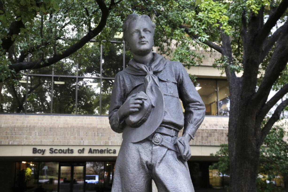 FILE - In this Feb. 12, 2020, file photo, a statue stands outside the Boy Scouts of America headquarters in Irving, Texas. Tens of thousands of men who say they were molested as children by scoutmasters and others will soon get a chance to vote on the Boy Scouts of America's reorganization plan. Votes are due by Dec. 14, 2021, and the judge has scheduled a January hearing on whether the plan should be approved.