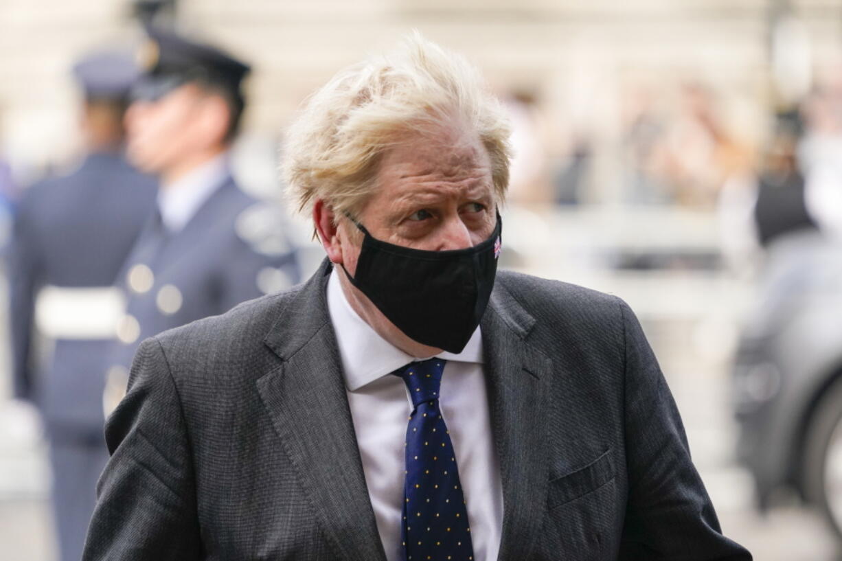 Britain's Prime Minister Boris Johnson arrives for a service to mark the 81st Anniversary of the Battle of Britain at Westminster Abbey, in London Sunday Sept. 19, 2021.