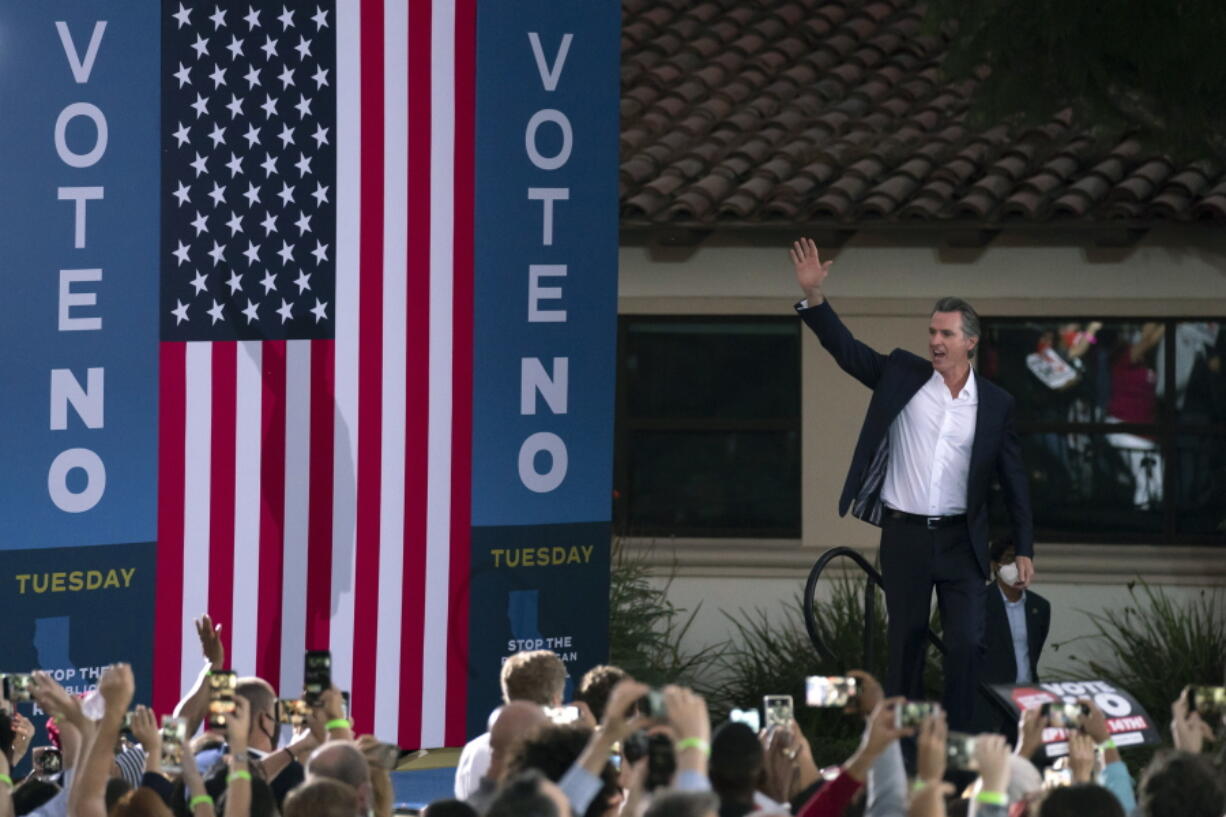 Supporters cheer California Gov. Gavin Newsom as he arrives at a rally ahead of the California gubernatorial recall election Monday, Sept. 13, 2021, in Long Beach, Calif. (AP Photo/Jae C.