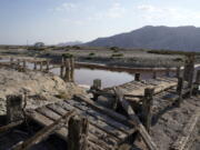 A dried up former boating dock is seen along the Salton Sea on July 14 in Desert Shores, Calif. Demand for electric vehicles has shifted investments into high gear to extract lithium from geothermal wastewater around California's dying Salton Sea.