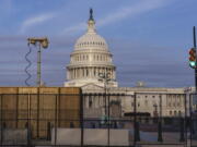 Security fencing and video surveillance equipment has been installed around the Capitol in Washington, Thursday, Sept. 16, 2021, ahead of a planned Sept. 18 rally by far-right supporters of former President Donald Trump who are demanding the release of rioters arrested in connection with the 6 January insurrection. (AP Photo/J.