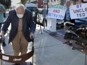 Former Cardinal Theodore McCarrick, left, arrives at Dedham District Court, Friday, Sept. 3, 2021, in Dedham, Mass.  McCarrick, the once-powerful American prelate who was expelled from the priesthood for sexual abuse, pleaded not guilty Friday to sexually assaulting a 16-year-old boy during a wedding reception in Massachusetts nearly 50 years ago.