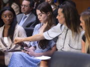 U.S. gymnasts, from left, Simone Biles, McKayla Maroney, Aly Raisman and Maggie Nichols arrive to testify during a Senate Judiciary hearing about the Larry Nassar investigation Wednesday on Capitol Hill in Washington.