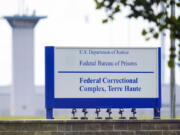 FILE - This Aug. 28, 2020, file photo shows the federal prison complex in Terre Haute, Ind. A former Bureau of Prisons officer who was serving time behind bars for an inappropriate sexual relationship with an inmate and a plot to kill his wife, as well as a separate plot to kill a federal agent who was investigating him, has been beaten to death at the USP Terre Haute federal prison in Indiana, two people familiar with the matter told The Associated Press.