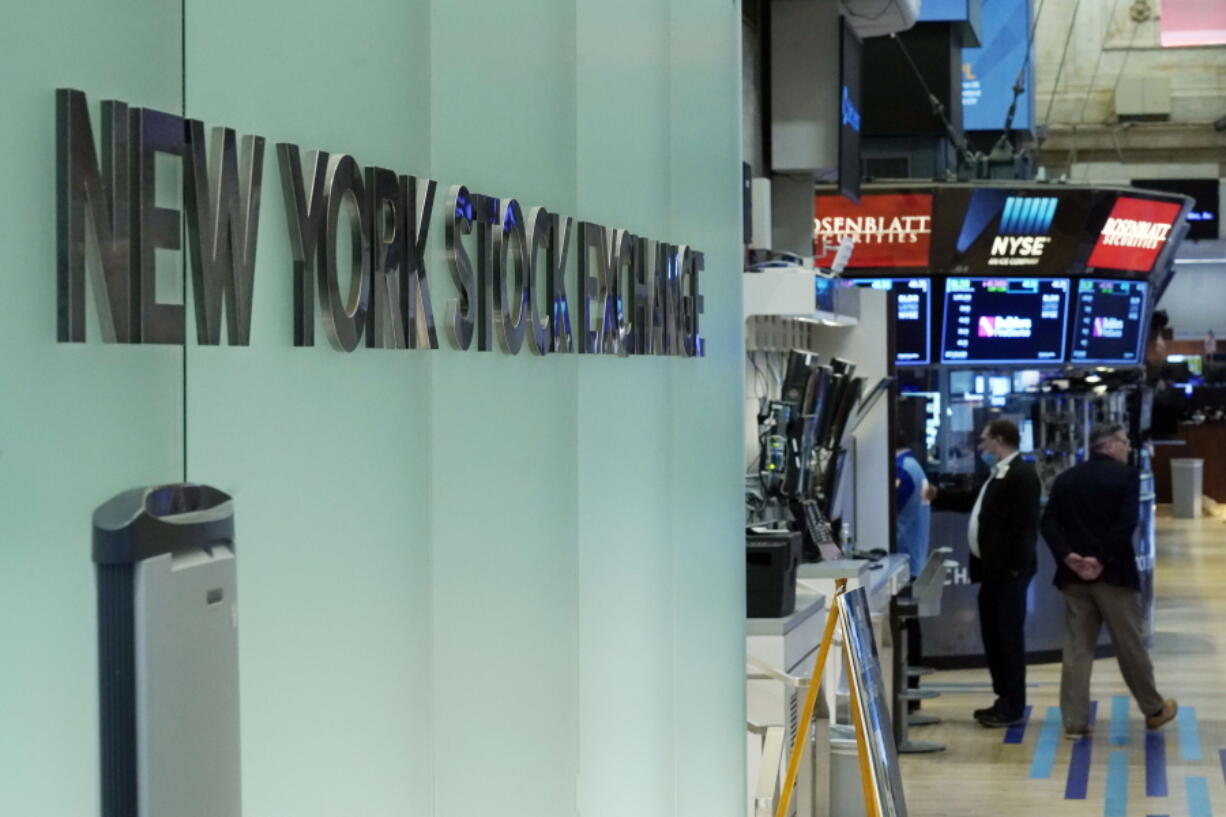 FILE - Traders work on the floor of the New York Stock Exchange, Monday, July 19, 2021. Stocks are inching higher in the early going on Wall Street Wednesday, Sept. 1, with gains from tech giants leading the way.