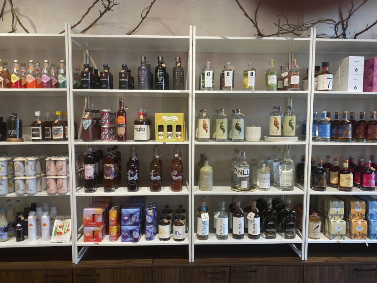 Non-alcoholic spirits are displayed at Boisson in New York in August 2021. Interest in a sober lifestyle has been growing for years, leading to the rise of mocktails and alcohol-free bars. The pandemic led even more people to question boozy drinking habits. Non-alcoholic options range from drinks that aim to replicate existing spirits to ones that promise something completely new.