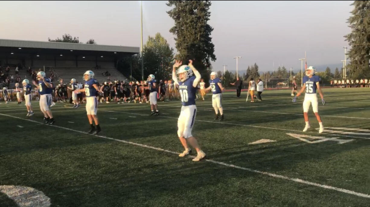 Mountain View players take the field for warmups prior to Friday's 46-2 victory over Kentlake at McKenzie Stadium (Meg Wochnick/The Columbian).