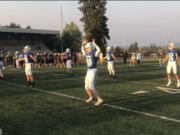 Mountain View players take the field for warmups prior to Friday's 46-2 victory over Kentlake at McKenzie Stadium (Meg Wochnick/The Columbian).