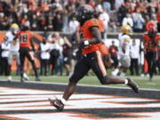 Oregon State running back B.J. Baylor (4) strides in to the end zone for a touchdown during the first half of an NCAA college football game against Idaho on Saturday, Sept. 18, 2021, in Corvallis, Ore.