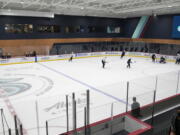 Seattle Kraken players take part in a practice session, Thursday, Sept. 9, 2021, during a media event for the grand opening of the Kraken's NHL hockey practice and community facility in Seattle. (AP Photo/Ted S.