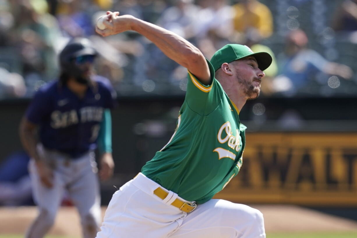 Oakland Athletics' Chris Bassitt pitches against the Seattle Mariners during the first inning of a baseball game in Oakland, Calif., Thursday, Sept. 23, 2021.