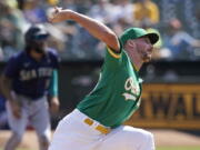 Oakland Athletics' Chris Bassitt pitches against the Seattle Mariners during the first inning of a baseball game in Oakland, Calif., Thursday, Sept. 23, 2021.