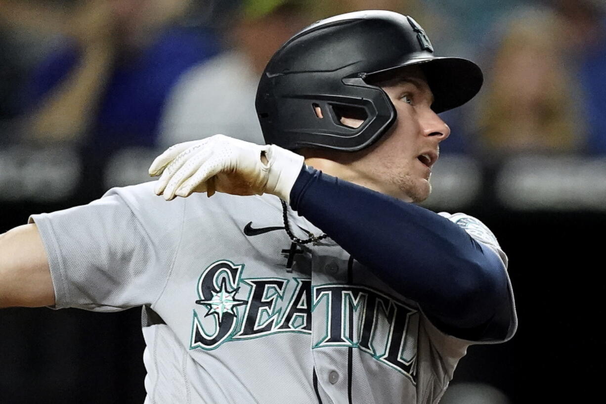 Seattle Mariners' Jarred Kelenic watches his two-run home run during the fourth inning of a baseball game against the Kansas City Royals Friday, Sept. 17, 2021, in Kansas City, Mo.