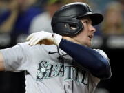 Seattle Mariners' Jarred Kelenic watches his two-run home run during the fourth inning of a baseball game against the Kansas City Royals Friday, Sept. 17, 2021, in Kansas City, Mo.