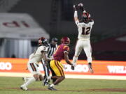 Oregon State linebacker Jack Colletto (12) jumps in front of Southern California wide receiver Gary Bryant Jr. (1) to intercept a pass during the second half of an NCAA college football game Saturday, Sept. 25, 2021, in Los Angeles.