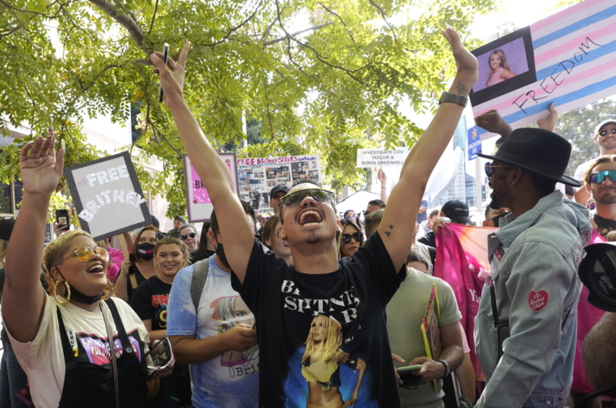 Britney Spears supporter Brian Molina of Los Angeles celebrates outside the Stanley Mosk Courthouse, Wednesday, Sept. 29, 2021, in Los Angeles.