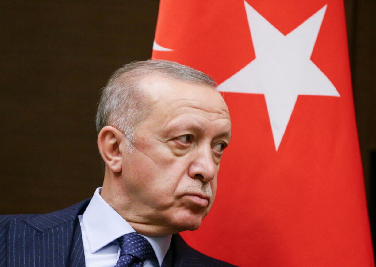 Turkish President Recep Tayyip Erdogan listens to Russian President Vladimir Putin during their meeting in the Bocharov Ruchei residence in the Black Sea resort of Sochi, Russia, Wednesday, Sept. 29, 2021.