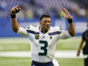 Seattle Seahawks quarterback Russell Wilson (3) waves to fans as he leaves the field following a 28-16 win over the Indianapolis Colts in an NFL football game in Indianapolis, Sunday, Sept. 12, 2021.