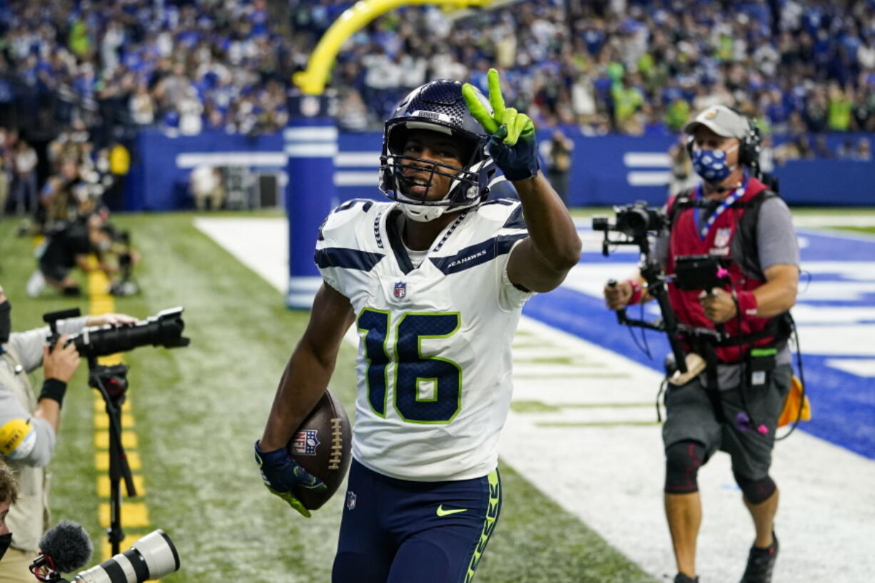 Seattle Seahawks wide receiver Tyler Lockett (16) celebrates after a touchdown against the Indianapolis Colts in the first half of an NFL football game in Indianapolis, Sunday, Sept. 12, 2021.