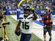 Seattle Seahawks wide receiver Tyler Lockett (16) celebrates after a touchdown against the Indianapolis Colts in the first half of an NFL football game in Indianapolis, Sunday, Sept. 12, 2021.