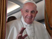 Pope Francis speaks with journalists on board an Alitalia aircraft enroute from Bratislava back to Rome, Wednesday, Sept. 15, 2021 after a four-day pilgrimage to Hungary and Slovakia.