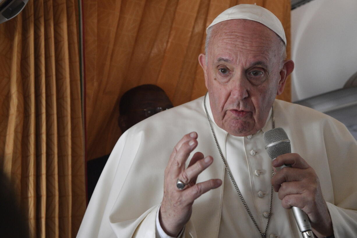 Pope Francis speaks with journalists on board an Alitalia aircraft enroute from Bratislava back to Rome, Wednesday, Sept. 15, 2021 after a four-day pilgrimage to Hungary and Slovakia.