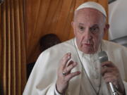 Pope Francis speaks with journalists on board an Alitalia aircraft enroute from Bratislava back to Rome, Wednesday, Sept. 15, 2021 after a four-day pilgrimage to Hungary and Slovakia.