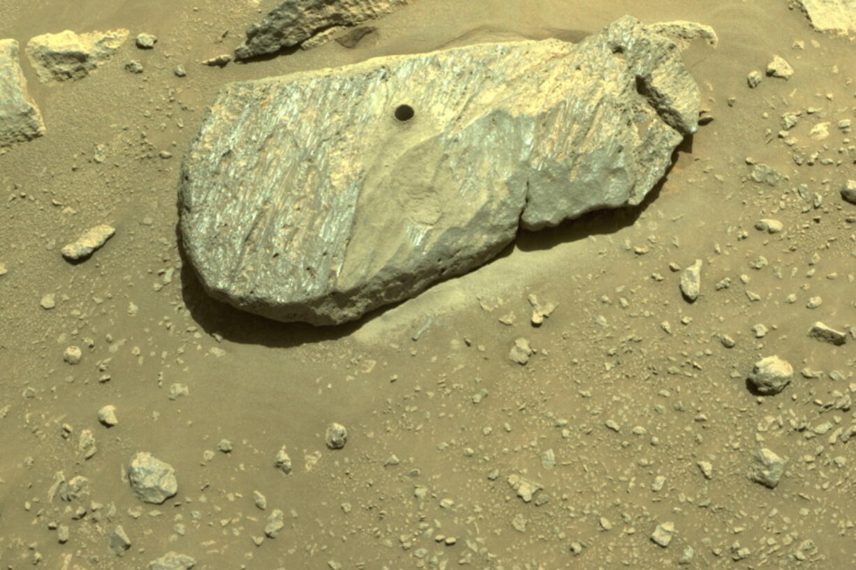 This Sept. 1, 2021 image provided by NASA shows the hole drilled by the Perseverance rover during its second sample-collection attempt in Mars' Jezero Crater.