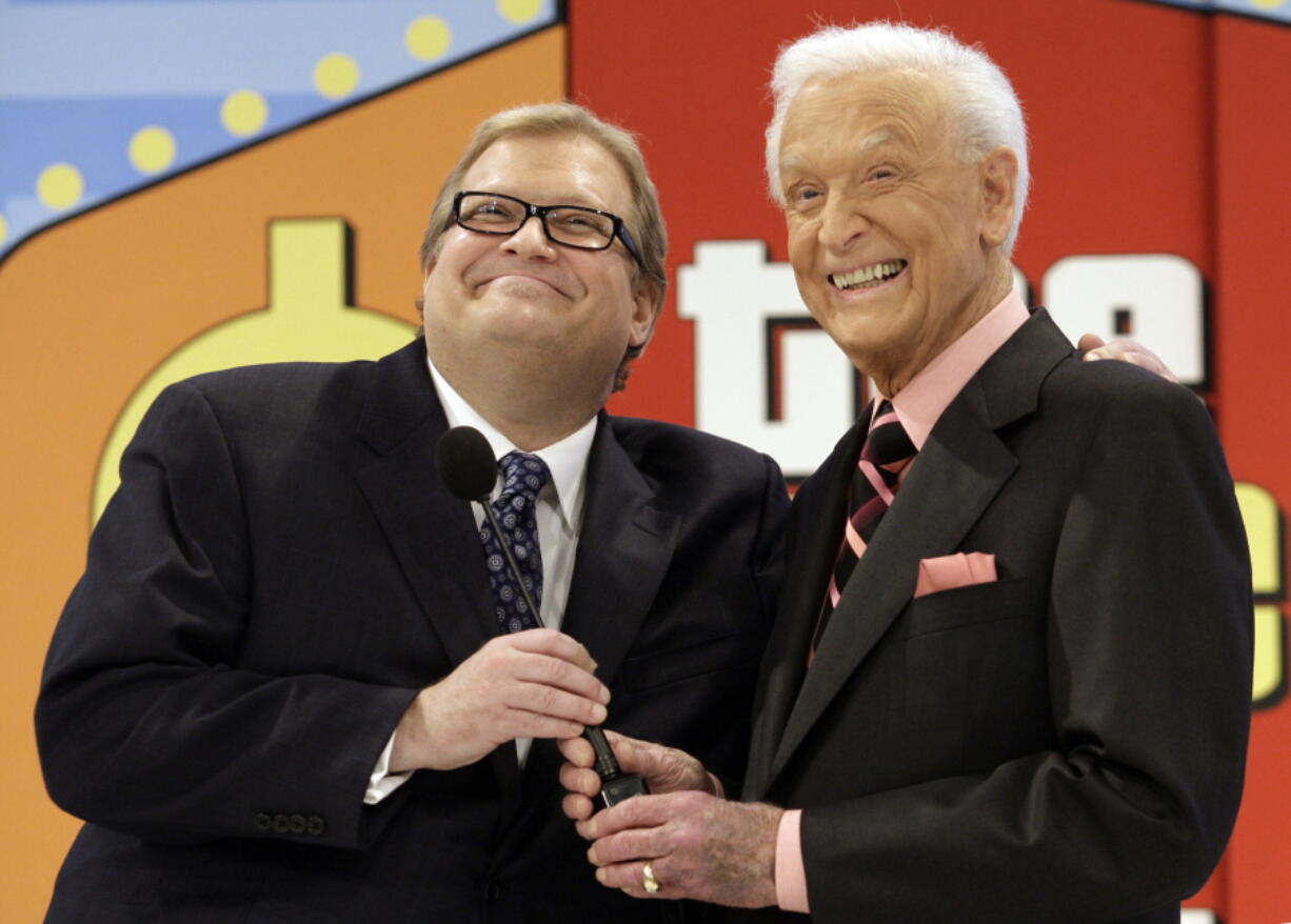 The Price is Right show host, comedian Drew Carey, left, appears with longtime former host Bob Barker at the CBS Studio Center in Los Angeles on March 25, 2009. The longest-running game show in television history is celebrating it's 50th season.