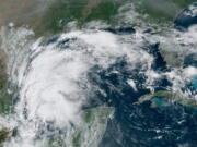 This satellite image provided by NOAA shows Tropical Storm Nicholas in the Gulf of Mexico on Sunday, Sept. 12, 2021. Tropical storm warnings have been issued for coastal Texas and the northeast coast of Mexico. Nicholas is expected to produce storm total rainfall of 5 to 10 inches, with isolated maximum amounts of 15 inches, across portions of coastal Texas into southwest Louisiana Sunday, Sept. 12 through midweek.