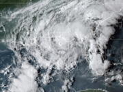 This GOES- East GeoColor satellite image taken Wednesday, Sept. 8, 2021, at 10:30 p.m. EDT., and provided by NOAA, shows Tropical Storm Mindy as it makes landfall on the Florida Panhandle. The storm touched down over St. Vincent Island, about 10 miles (15 km) west southwest of Apalachicola, according to the National Hurricane Center.