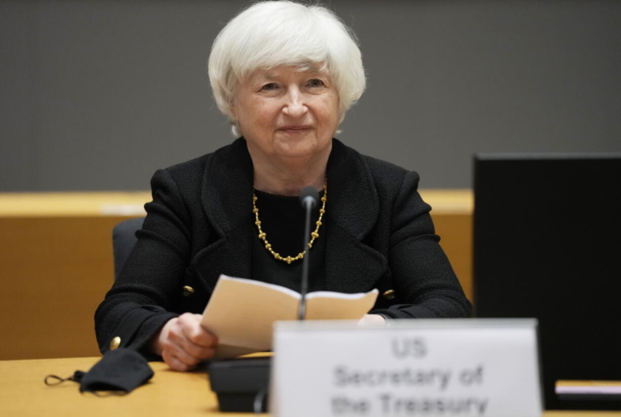 FILE - In this July 12, 2021 file photo, U.S. Treasury Secretary Janet Yellen prepares to speak during a meeting  at the European Council building in Brussels. Yellen is telling Congress that the Treasury Department will likely exhaust all of its "extraordinary measures" to avoid an unprecedented default on the government's obligations by Oct. 18. In a letter to congressional leaders Tuesday, Sept. 28, 2021 Yellen said her agency had been able to refine its earlier forecast that this deadline would occur some time in October.