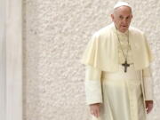 Pope Francis arrives for his weekly general audience in the Paul VI hall, at the Vatican, Wednesday, Sept. 1, 2021.