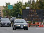 A sign directs motorists to a COVID-19 testing site, Wednesday, Sept. 22, 2021, in Tukwila, Wash., south of Seattle. (AP Photo/Ted S.