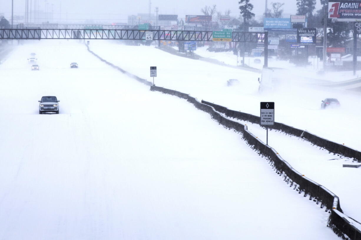 Traffic is sparse Feb. 15 on Interstate 45 following an overnight snowfall in The Woodlands, Texas, as temperatures plunged into the teens.