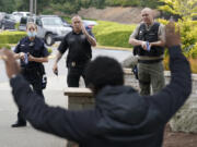 A training exercise is shown in July. The Vancouver Police Department received 84 suggestions on how it can improve internal operations. It has fulfilled most of the suggestions but still has to create an internal critical incident review board, work on data collection and further its police camera program.