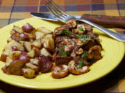 Steak in red wine sauce with garlic potatoes.