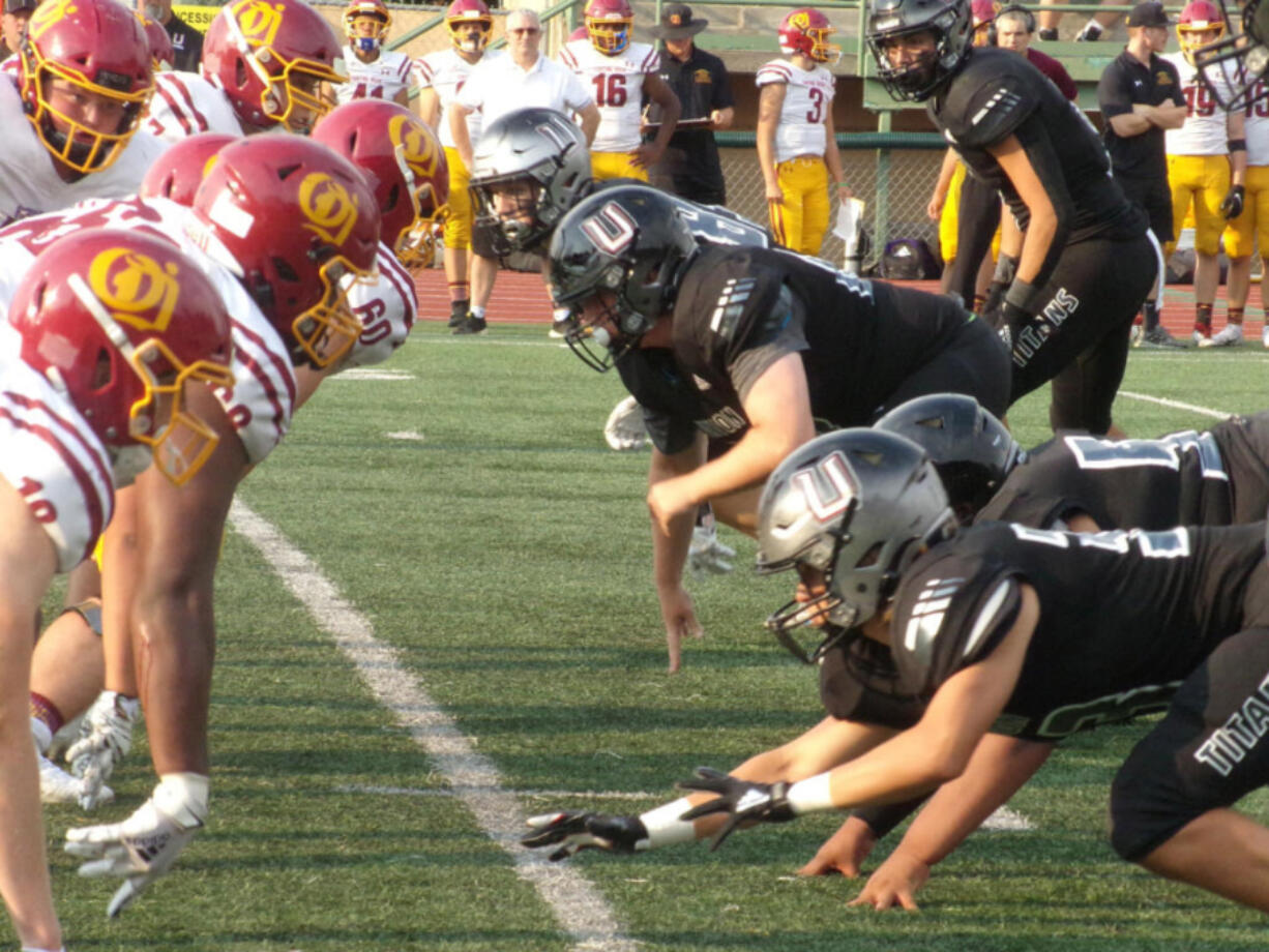 Players from O?Dea of Seattle and Union line up before the snap on Friday, Sept.