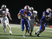 Ridgefield's Davis Pankow runs into the end zone for one of his three rushing touchdowns Thursday against Mark Morris in the 2A Greater St. Helens League game at Ridgefield High School. Ridgefield won 42-0.