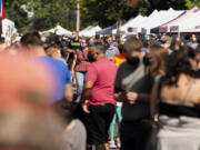 Mostly masked guests crowd the streets at the Vancouver Farmers Market on Sept. 4 in downtown Vancouver. After <a href="https://www.columbian.com/news/2019/oct/29/vancouver-farmers-market-sets-record/">its most popular year in 2019, when an estimated 420,000 people visited the market</a>, it had in 2020 a major dropoff due to the pandemic and its restrictions, but the 2021 season has had about 170,000 shoppers visit so far this year.