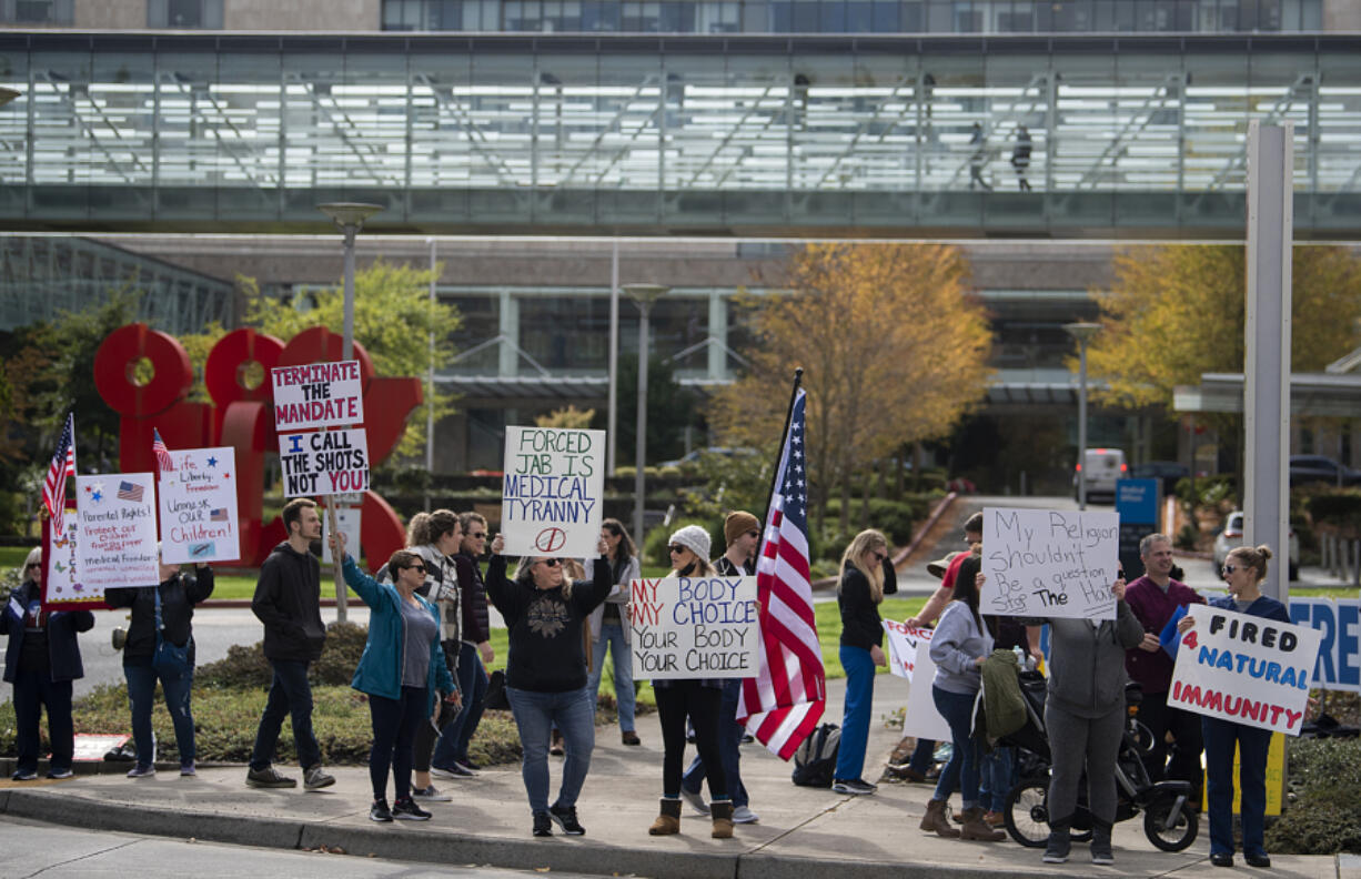 Medical staff placed on administrative leave and those against a vaccination mandate gather during a protest outside Legacy Salmon Creek Medical Center on Friday afternoon. According to Legacy, 794 unvaccinated employees were placed on leave beginning Friday.