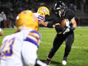 Hockinson senior Cody Wheeler runs the ball Friday, Oct. 8, 2021, during the Hawks??? 31-6 win against Columbia River at Hockinson High School.