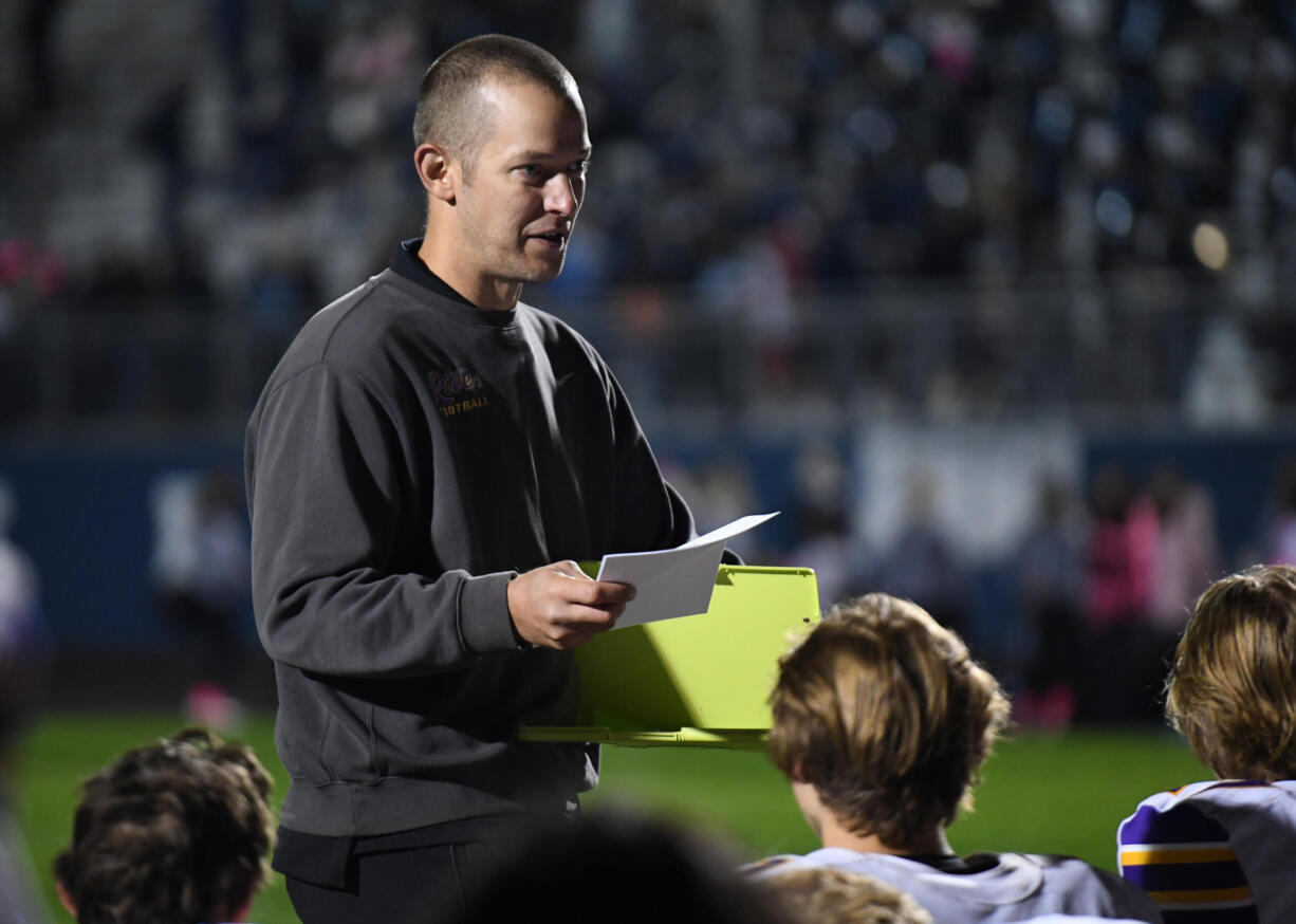 Columbia River head football coach Brett Smedley talks to his team Friday, Oct. 8, 2021, after Columbia River’s 31-6 loss to Hockinson at Hockinson High School.