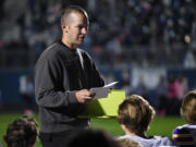 Columbia River head football coach Brett Smedley talks to his team Friday, Oct. 8, 2021, after Columbia River’s 31-6 loss to Hockinson at Hockinson High School.