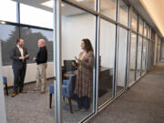 Al Angelo Co. President Albert Angelo III, left, chats with Scott Wilcox and Bari Smith of JD Fulwiler & Co. Insurance in the commercial side of Vancouver's newest building, the Angelo Tower.