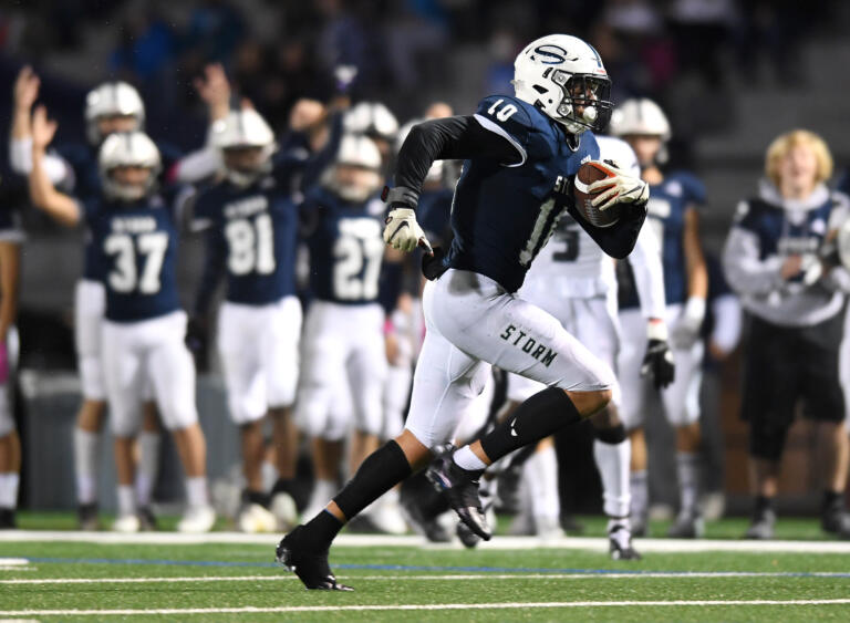 Skyview senior Tanner Beaman runs to the end zone Thursday, Oct. 14, 2021, during the Storm's 37-7 win against Union at the Kiggins Bowl in Vancouver.