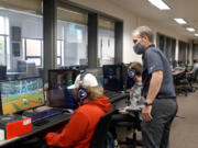 Battle Ground Public Schools Superintendent Denny Waters watches an esports practice at Battle Ground High School.