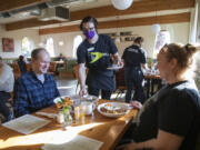 Nicole Kluka serves breakfast to Brian and Leah Trudell at The Diner Vancouver. As fans of diners and midcentury style, the Trudells were excited for their first visit.