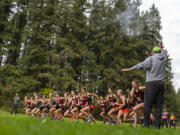 Varsity girl???s cross country runners begin their race Wednesday, Oct. 20, 2021, during the 4A Greater St. Helens League Cross Country District Meet at Lewisville Regional Park in Battle Ground.